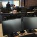 Marketing data analyst Kevin Riegle works at his desk at HookLogic. Melanie Maxwell I AnnArbor.com